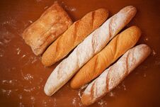 Assortment Of Baked Bread On Wooden Background. Top View. Stock Photo