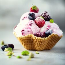 Pink Ice Cream With Berries, Strawberries, Blueberries, Raspberries, Pistachios In Waffle Basket. Summer Food Concept Stock Photos