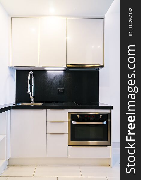 Faucet and sink decoration in kitchen room interior