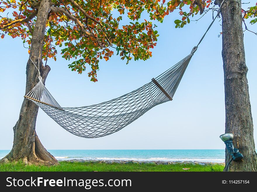Empty Hammock on the beach and sea - Vacation concept. Empty Hammock on the beach and sea - Vacation concept