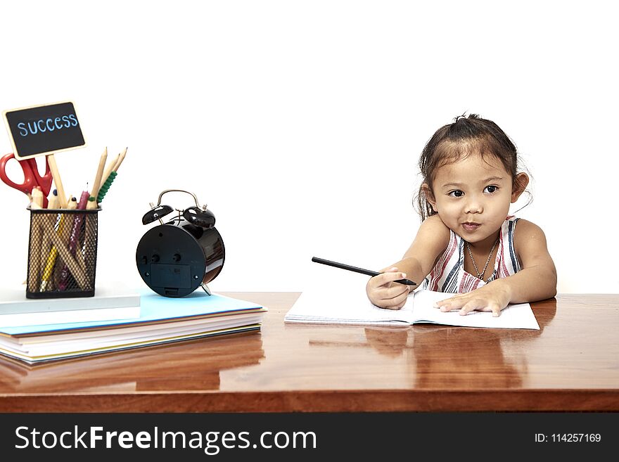 Asian little girl writing doing homework early childhood education, back go to school. Asian little girl writing doing homework early childhood education, back go to school