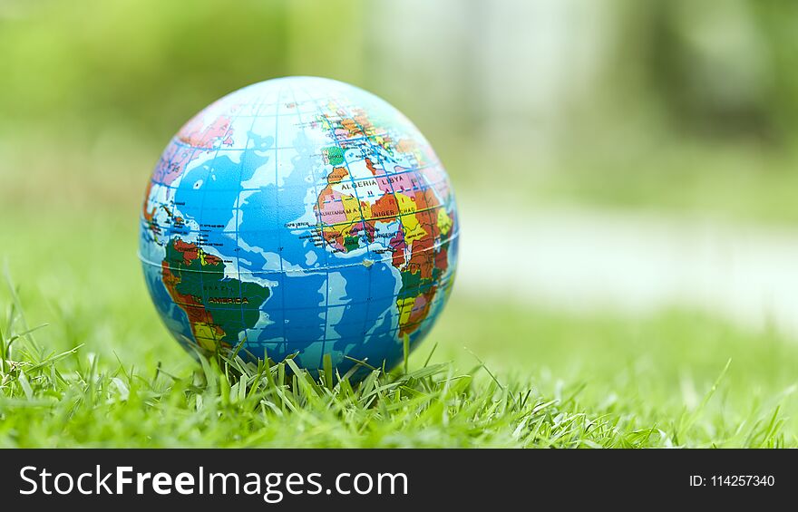 Globe Lies On Green Grass