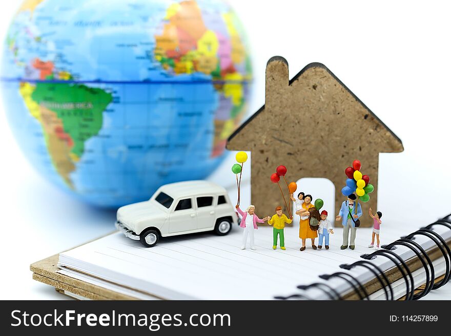 Miniature people : family and children with colorful ballons standing of mini house and car with world map background,International Day of Families