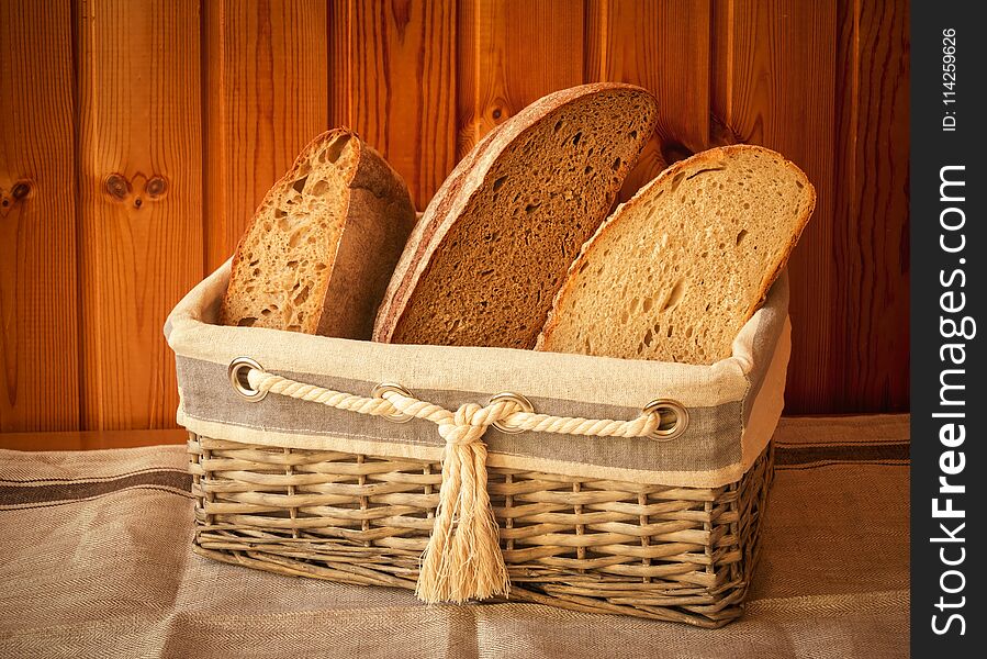 Rustic wicker basket with fresh bread. Vintage style.