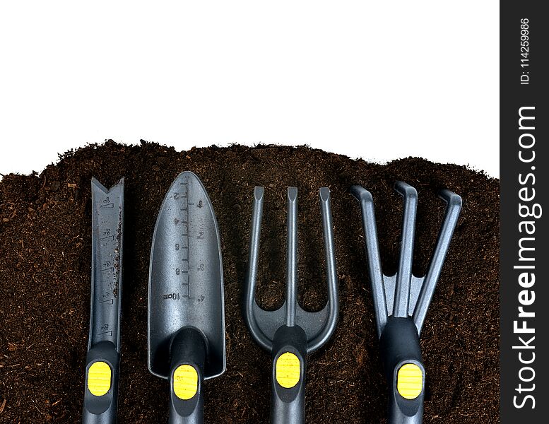 Garden tools on soil with copy space. Garden tools on soil with copy space.