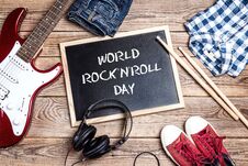 World Rock`n`Roll Day Background With Blackboard, Music Equipmen Royalty Free Stock Photo
