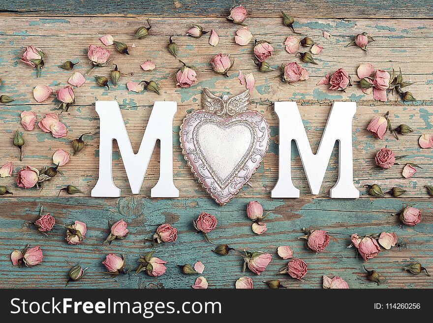 Mothers day background with letters and small pink roses on old