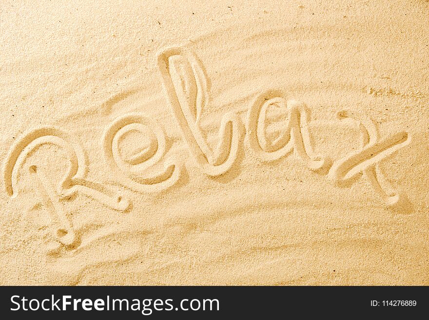 Word Relax on sand beach concept background idea