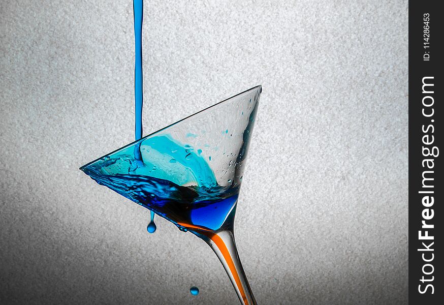 Blue drink pour at martini glass