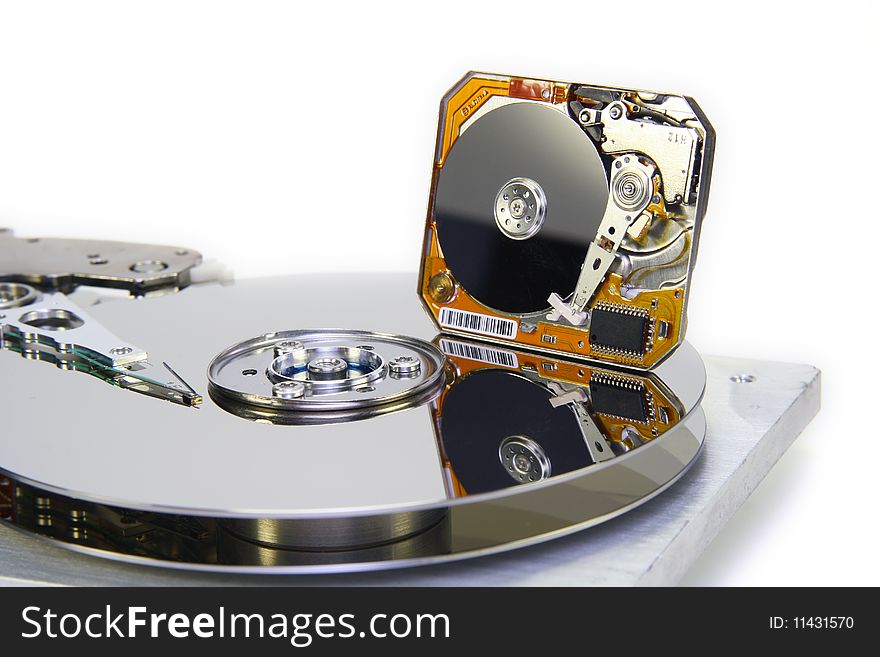 The image shows progress in miniaturization of hard disks. Near to standard HDD 3,5 it is located Mini HDD 1. It is isolated on the white. The image shows progress in miniaturization of hard disks. Near to standard HDD 3,5 it is located Mini HDD 1. It is isolated on the white.