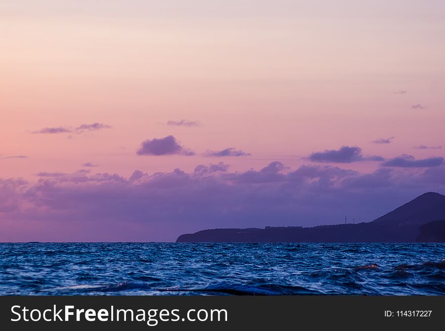 Summer sea sunset, the sun, waves and clouds, beautiful dramatic lighting. Summer sea sunset, the sun, waves and clouds, beautiful dramatic lighting