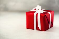 Red Gift Box On Grey Concrete Background, Copy Space. Christmas, New Year, Birthday Party, Valentine`s Day, Mother`s And Royalty Free Stock Photos