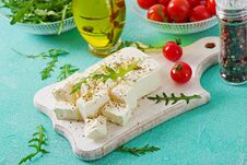 Feta Cheese, Cherry Tomatoes And Rucola On The Table. Ingredients For Salad Royalty Free Stock Photos