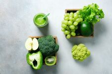 Green Smoothie In Glass Jar With Fresh Organic Green Vegetables And Fruits On Grey Background. Spring Diet, Healthy Raw Stock Image