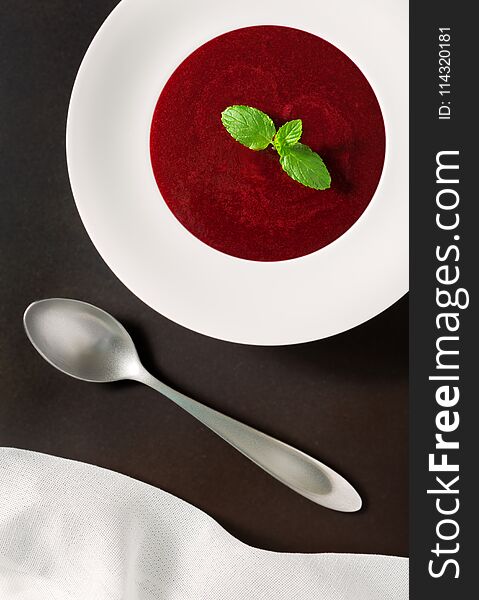 Organic Raw Beet Soup with a Mint Sprig Shot from Overhead. Organic Raw Beet Soup with a Mint Sprig Shot from Overhead