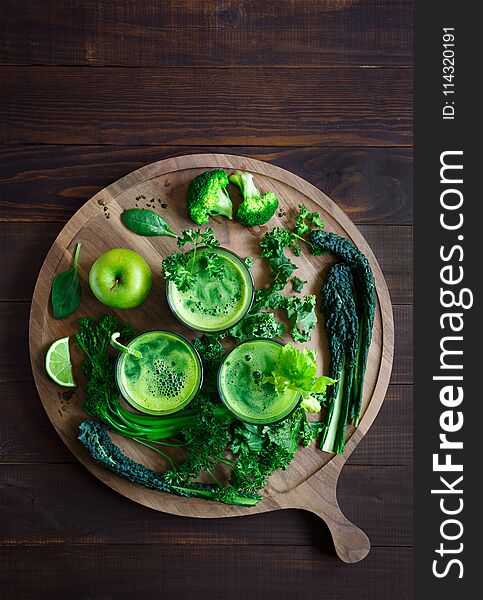 Fresh Organic Green Juice Shot from Overhead on a Round Board with Ingredients. Fresh Organic Green Juice Shot from Overhead on a Round Board with Ingredients