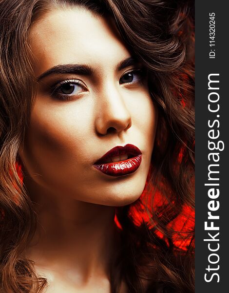 Beauty Woman with Perfect Makeup Beautiful Professional Holiday Make-up. Red Lips and Nails Beauty Girls Face isolated on Black background Glamorous Woman