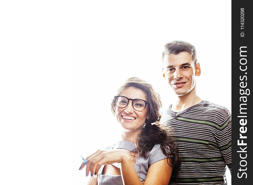 Young pretty teenage couple, hipster guy with his girlfriend happy smiling and hugging isolated on white background, lifestyle people concept close up