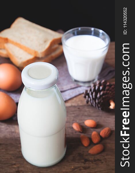Almond milk bottle, sliced bread and boiled eggs, Healthy dairy products