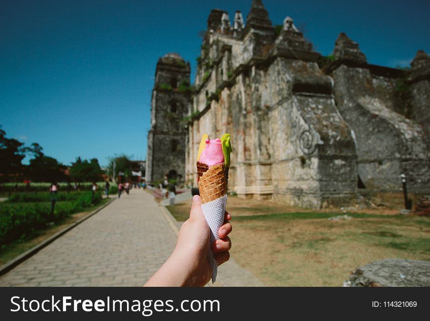 Person Holding Ice Cream With Cone