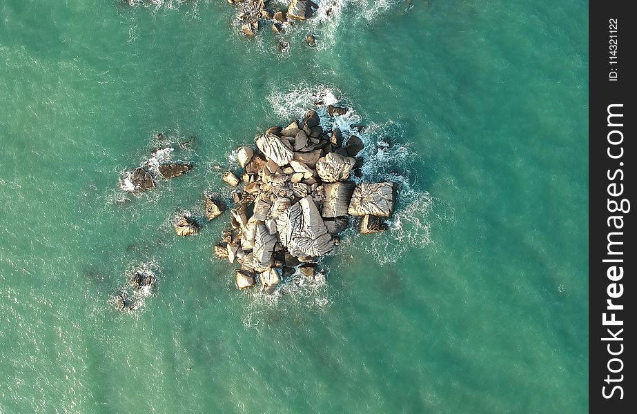 Top View of Rock Formations Surrounded by Water