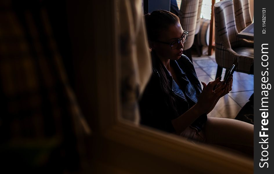 Woman Looking at Her Phone