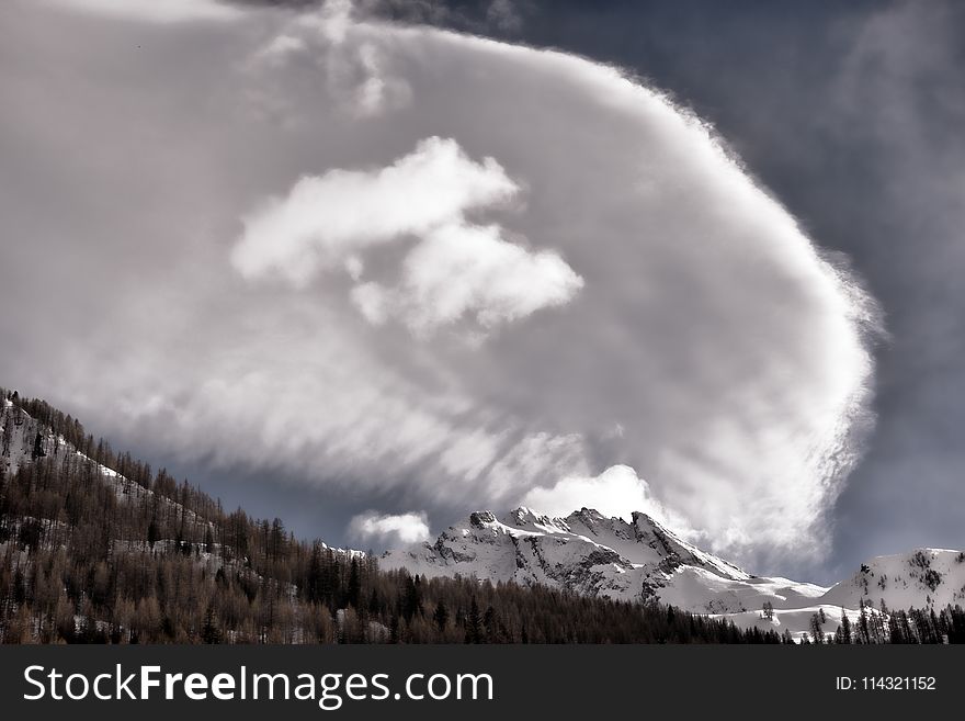 Photography of Mountain Under Cloudy Sky