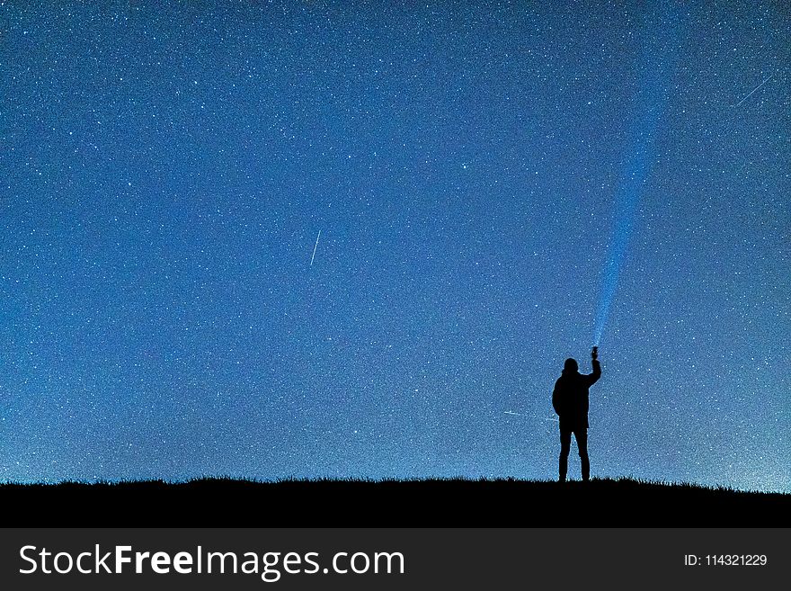 Silhouette Of Man Under Blue Sky During Nighttime