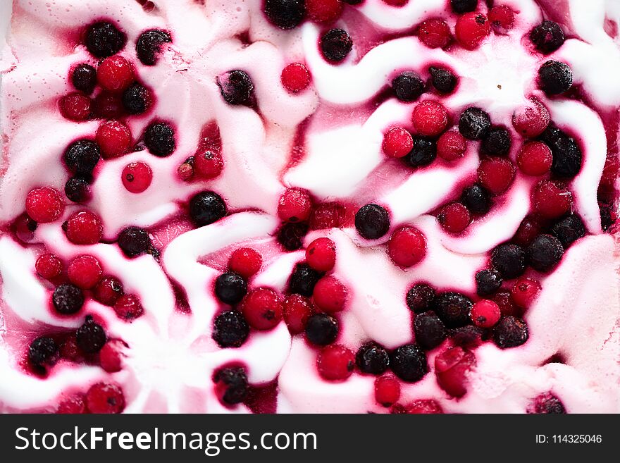 Pink ice cream with berries background. Cranberries in frozen ice-cream bowl texture. Copy space