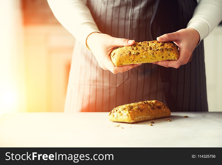 Woman Hands Holding Freshly Baked Bread. Bun, Cookie, Bakery Concept, Homemade Food, Healthy Eating. Copy Space. Banner.