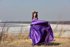 Woman Lilac Dress With A Wreath Of Flowers On Her Head On Nature Royalty Free Stock Photos