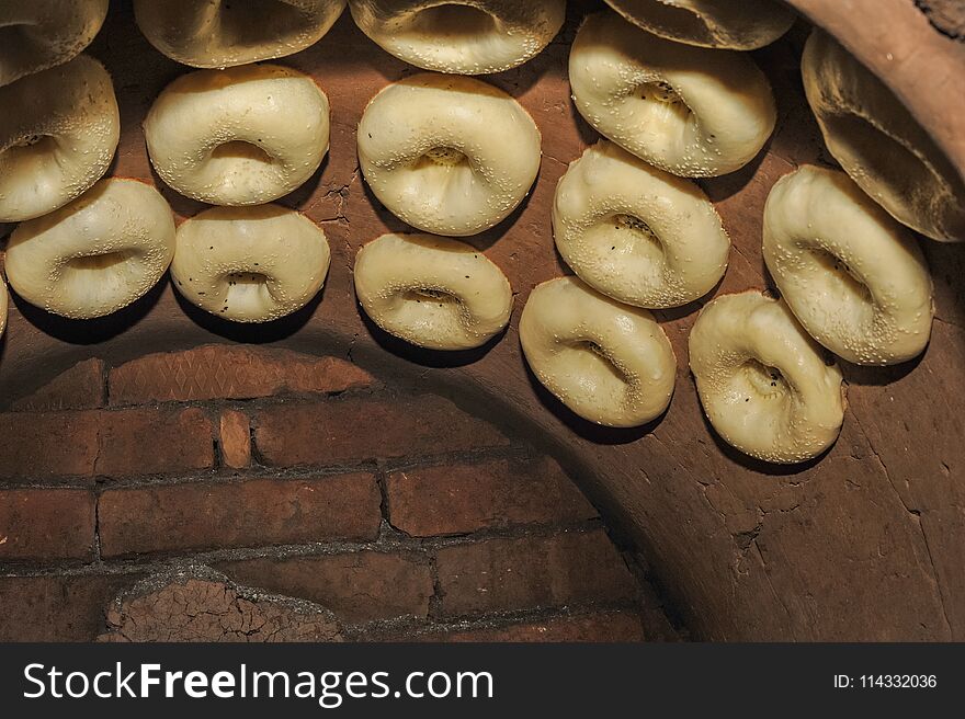 Process of cooking tandoor bread national Uzbek flatbread