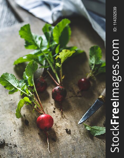 Fresh Radishes On Kitchen Table