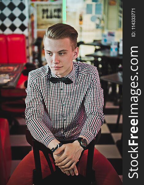 Portrait Of A Boy In A Striped Shirt And A Bow Tie In The Cafe 5883.