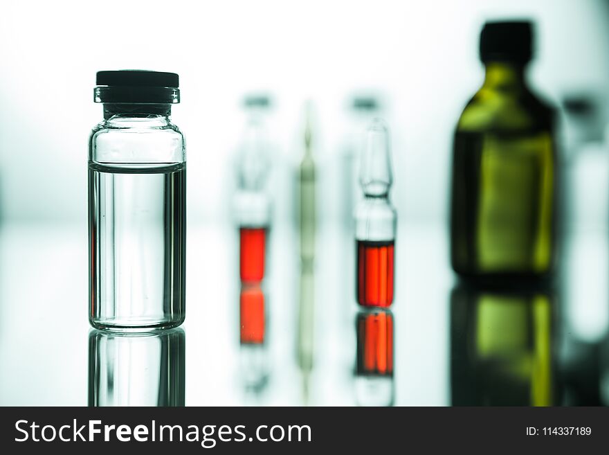 Group object of liquid medicinal agent in limpid glassware in medical laboratory. Group object of liquid medicinal agent in limpid glassware in medical laboratory