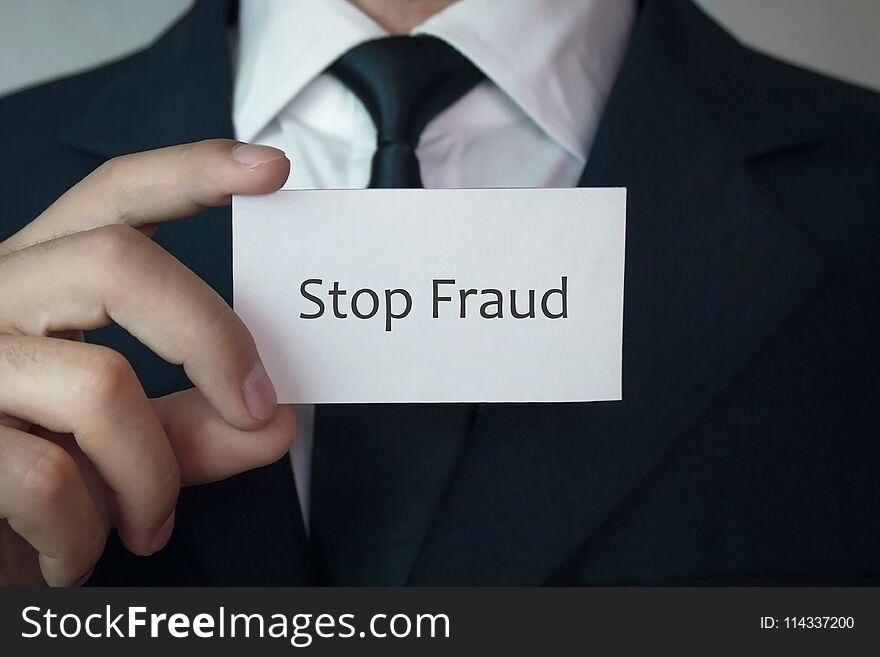 Man holding Stop fraud word.