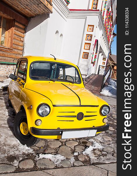 ZAZ Yellow Retro Car Parked On The Parking Space.