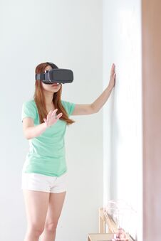 Young Woman Wearing Virtual Reality Glasses At Home. Stock Photography
