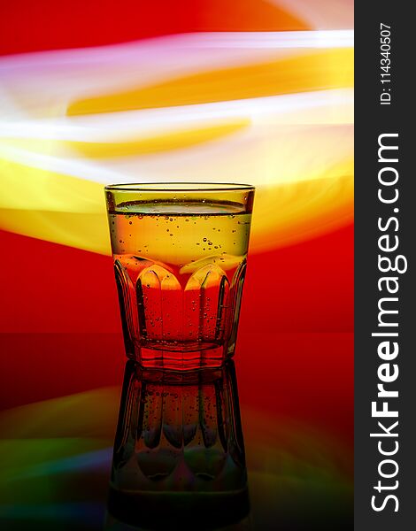 Fresh modern faceted glass on the colorful background