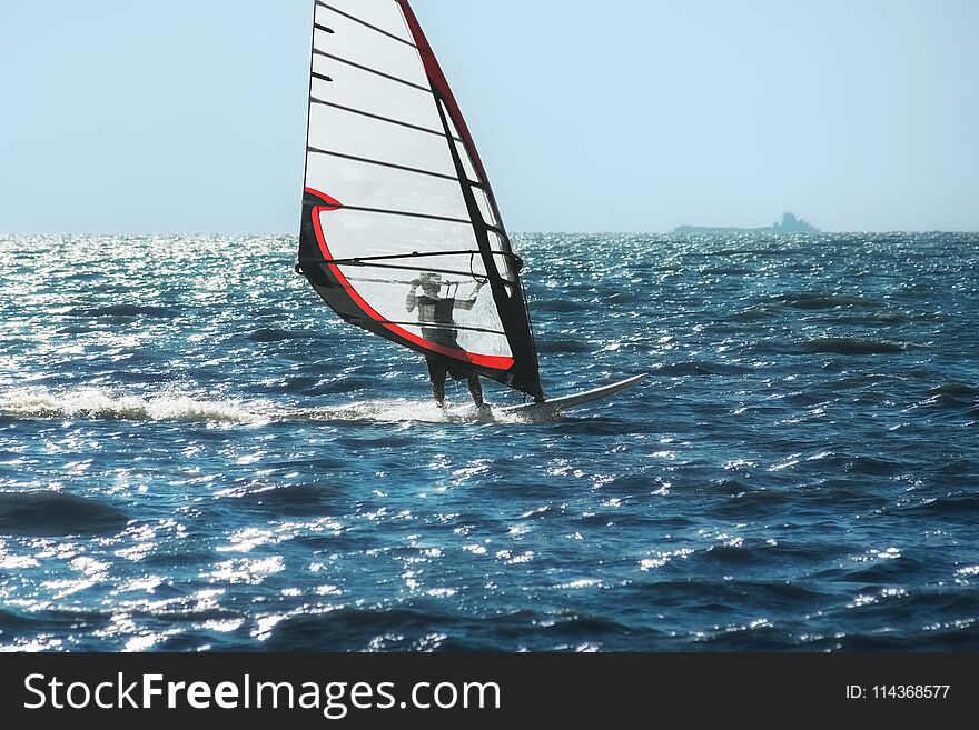 Windsurfing On The Background Of Sea And Sky