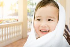 Happy Cute Mixed Race Chinese And Caucasian Boy On A Patio Royalty Free Stock Photos