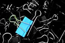 A Color Binder Clip ,multi Binder Paper Clip Backgtound In Black Stock Photography