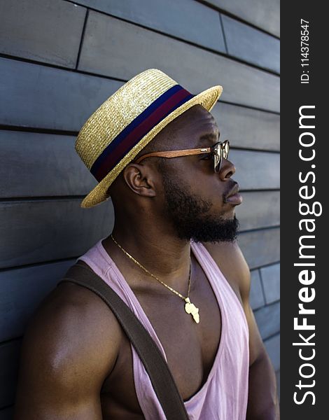 Man Wearing Hat And Pink Tank Top