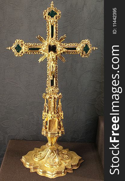 Close up of a golden cross representing religion