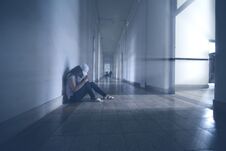 Lonely Woman Sitting In The Hallway Royalty Free Stock Photo Lonely Woman Sitting In The Hallway Royalty Free Stock Photo