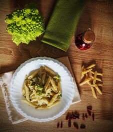Pasta And Roman Cauliflower On A Wooden Table Stock Photo