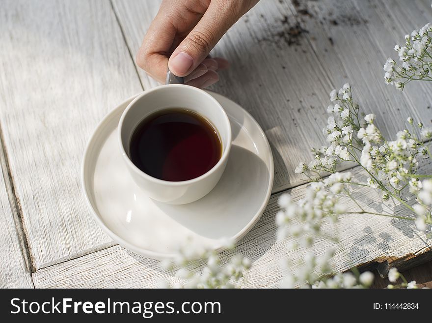 White Ceramic Teacup on Saucer