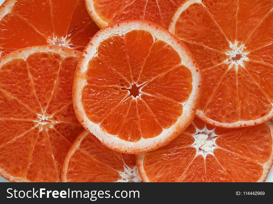 Close Up Photograph of Slices Orange Citrus Fruits