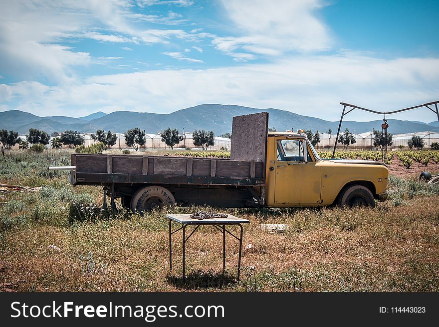 Yellow Truck On Field