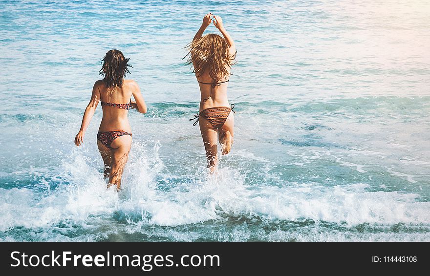Two Women Wearing Bikini